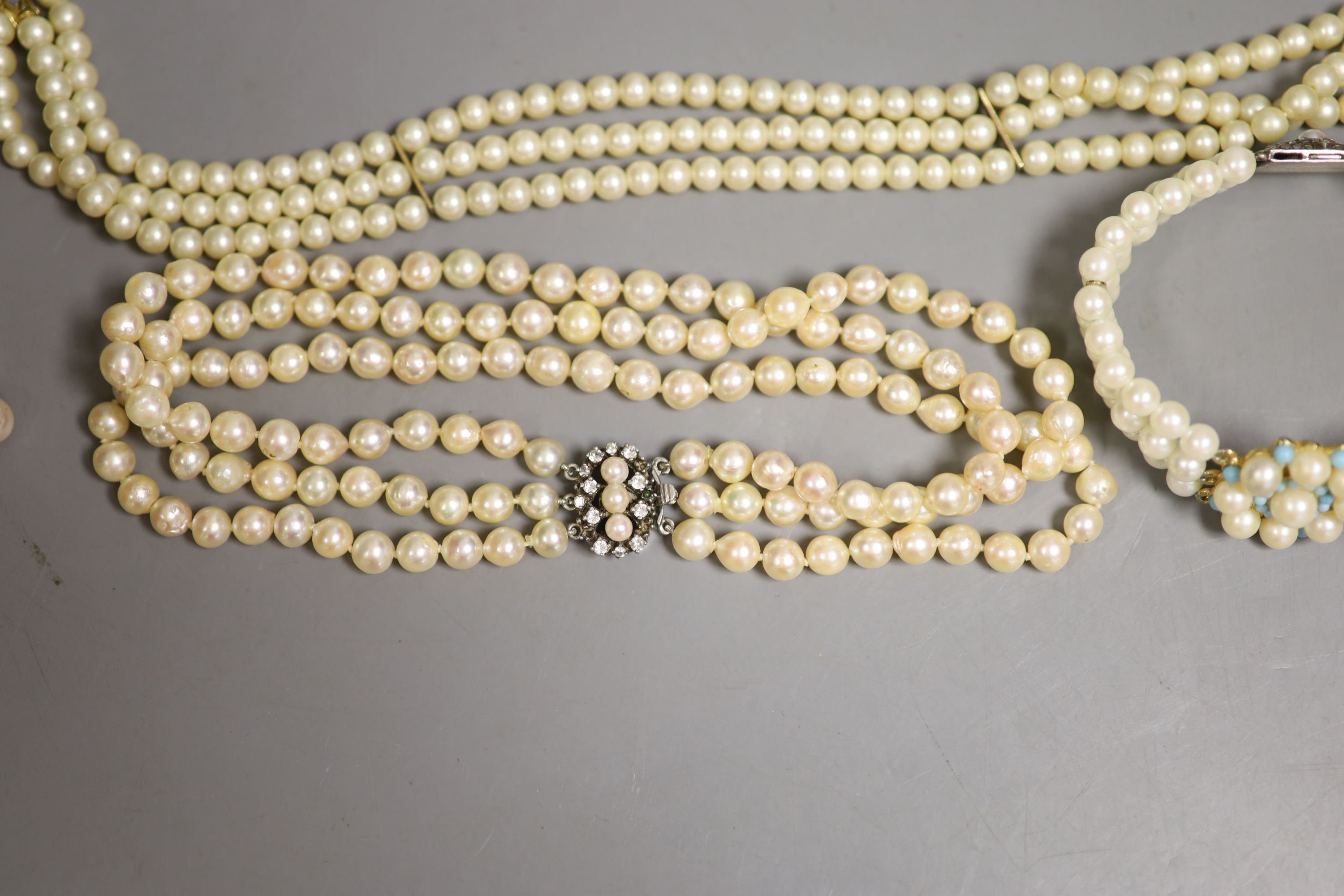 A triple strand cultured pearl choker necklace and four other items.